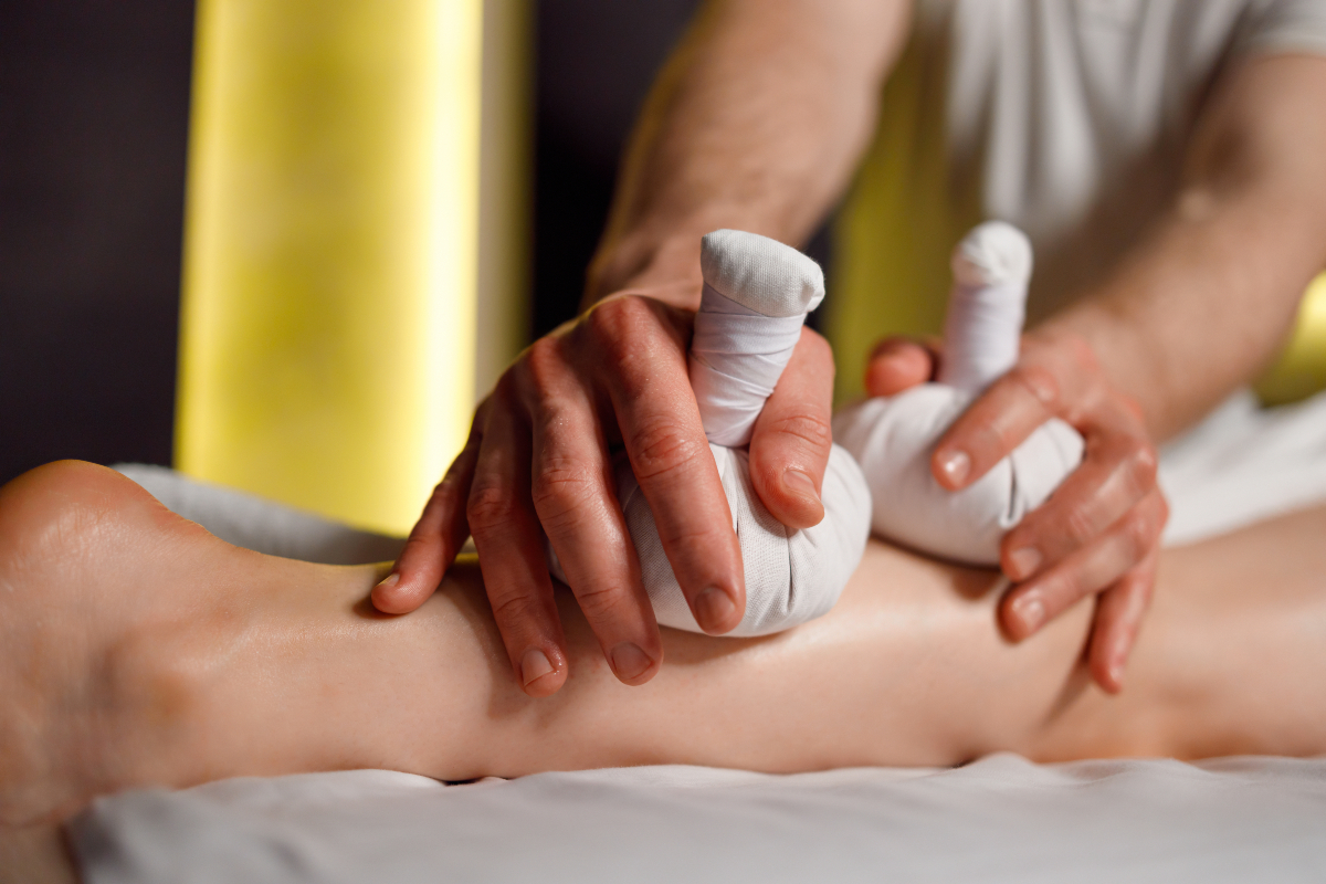 Foot massage with herbal bags